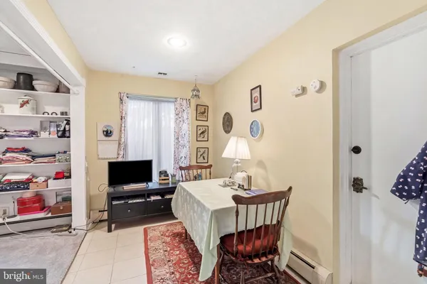a view of a livingroom with furniture and a flat screen tv