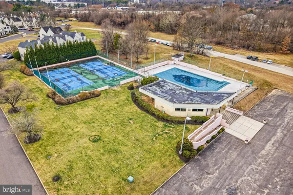 swimming pool view with a lounge chair