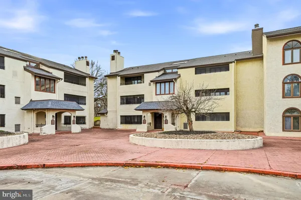 a view of a building with a street