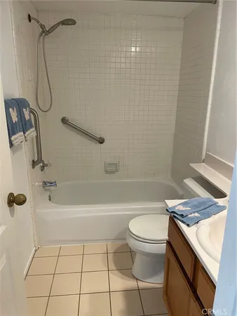 a bathroom with a tub and a shower
