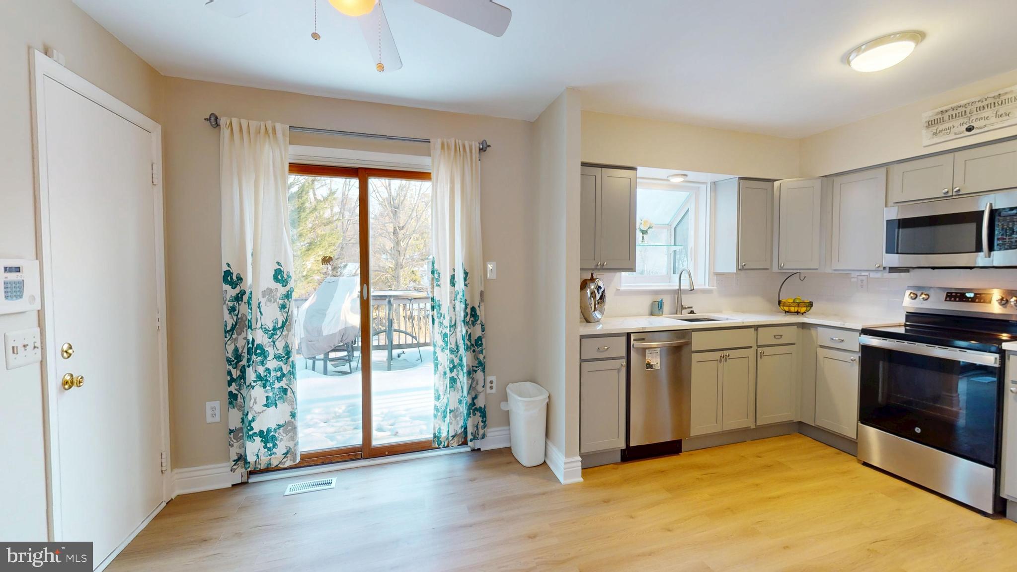 11707 Balsamwood Terrace Laurel, MD 20708 - Photo 14 of 28 view from living room to dining & kitchen