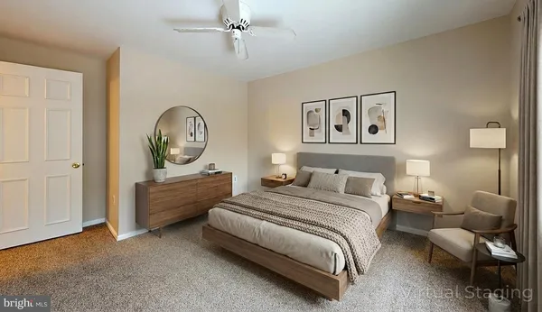 a bedroom with a bed a mirror and a window