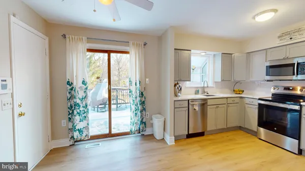 a kitchen with a refrigerator and a sink