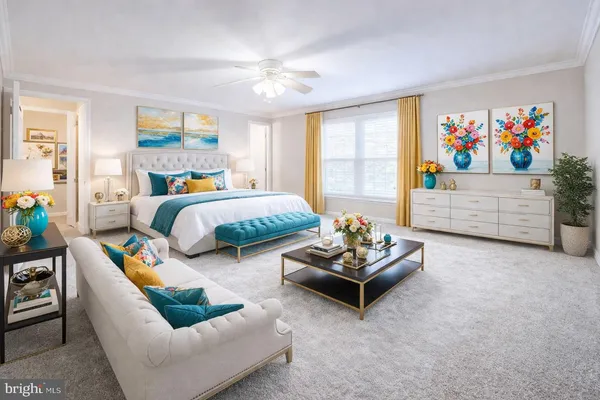 a bedroom with furniture and a large window