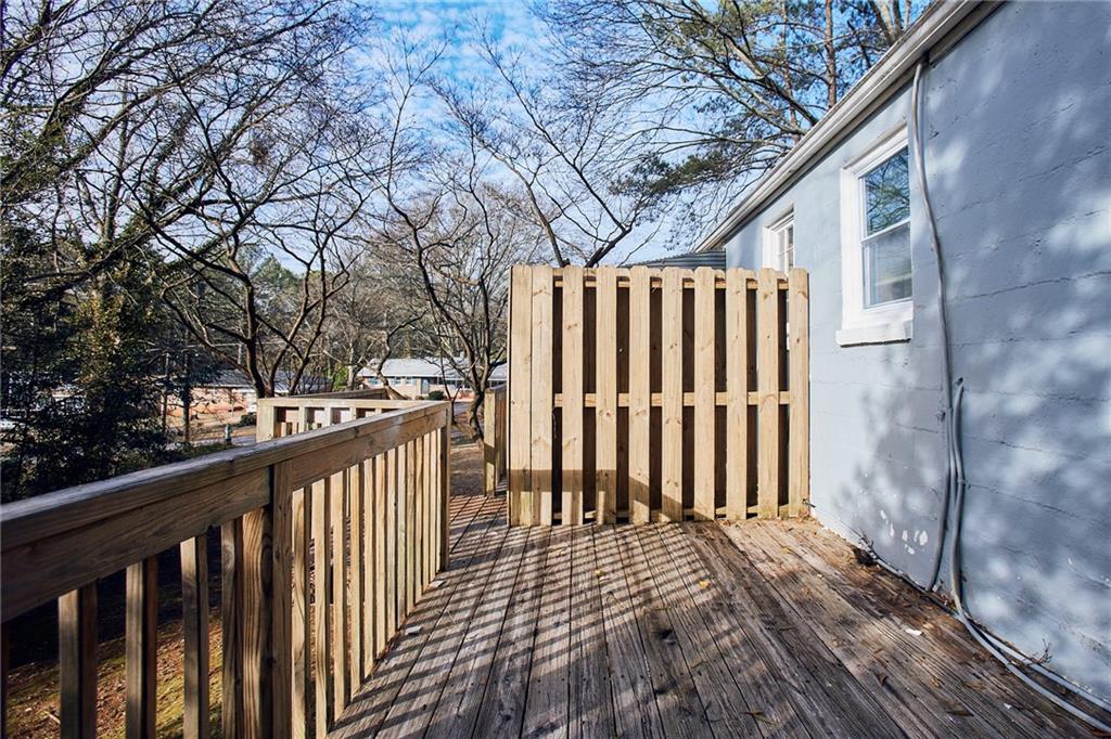 3323 Midway Road, Unit 1 Decatur, GA 30032 - Photo 6 of 10 a view of a wooden street from a balcony