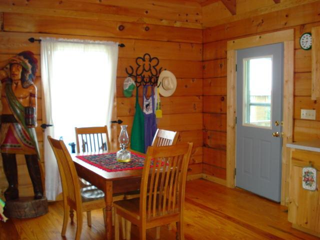 4646 Summitville Road Morrison, TN 37357 - Photo 5 of 11 a view of a dining room with furniture and wooden floor