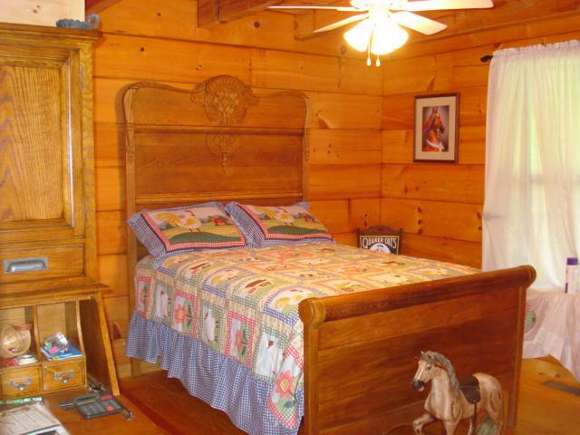 4646 Summitville Road Morrison, TN 37357 - Photo 7 of 11 a bedroom with a bed and wooden floor
