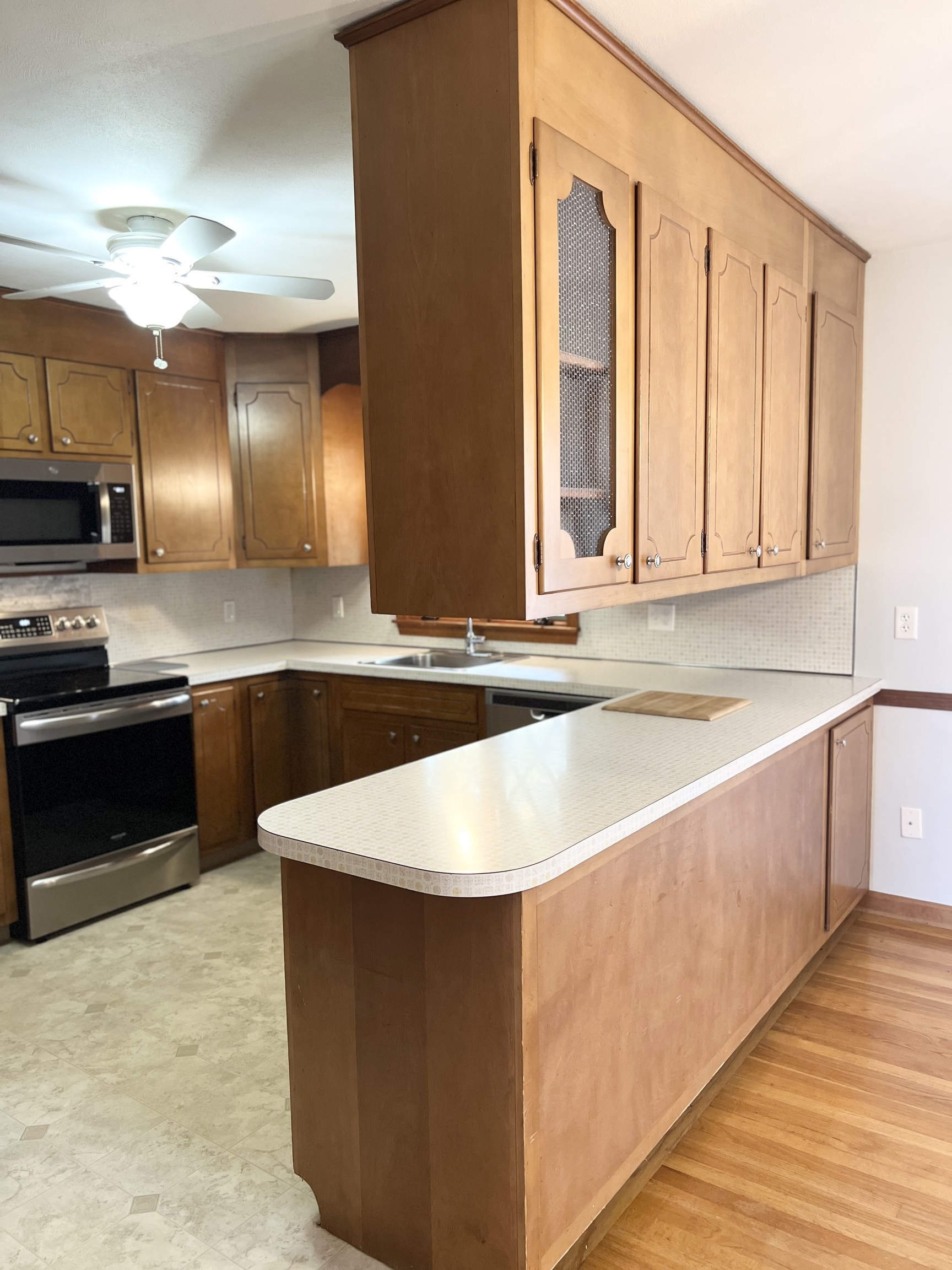 524 Saybrook Road Haddam, CT 06438 - Photo 11 of 38 a kitchen with stainless steel appliances granite countertop a sink a stove and a microwave