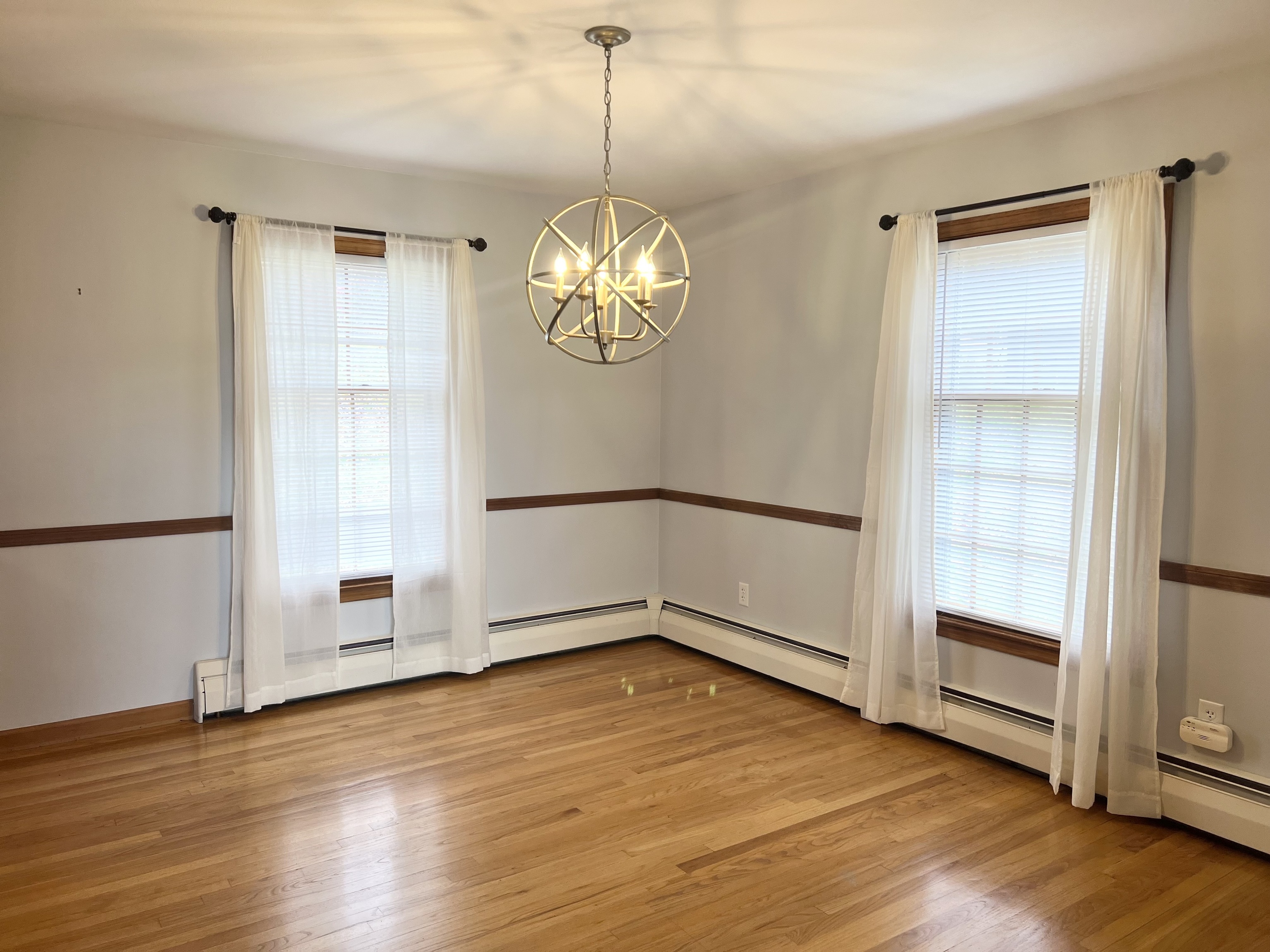 524 Saybrook Road Haddam, CT 06438 - Photo 13 of 38 a view of empty room with wooden floor and fan