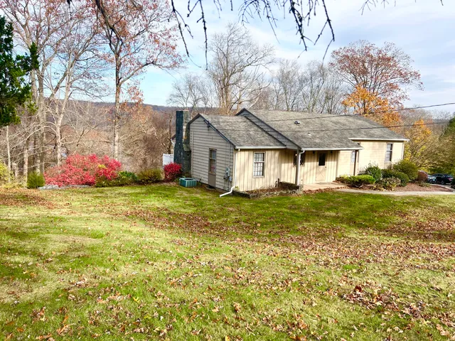 a view of front door with livingroom and fireplace