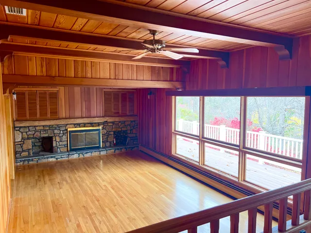 a view of entryway with wooden floor and chandelier