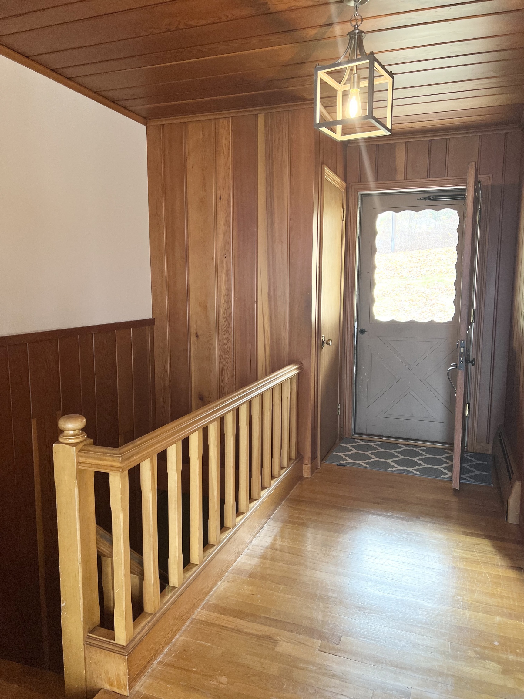 524 Saybrook Road Haddam, CT 06438 - Photo 20 of 38 a view of entryway with wooden floor and chandelier