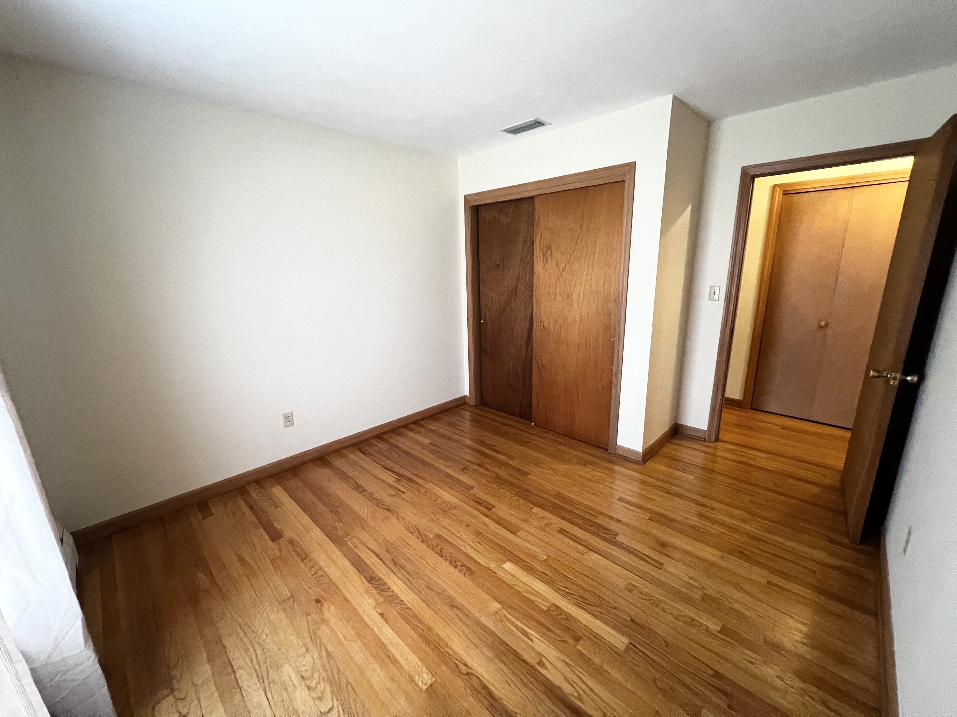 524 Saybrook Road Haddam, CT 06438 - Photo 31 of 38 a view of an empty room with wooden floor and a window