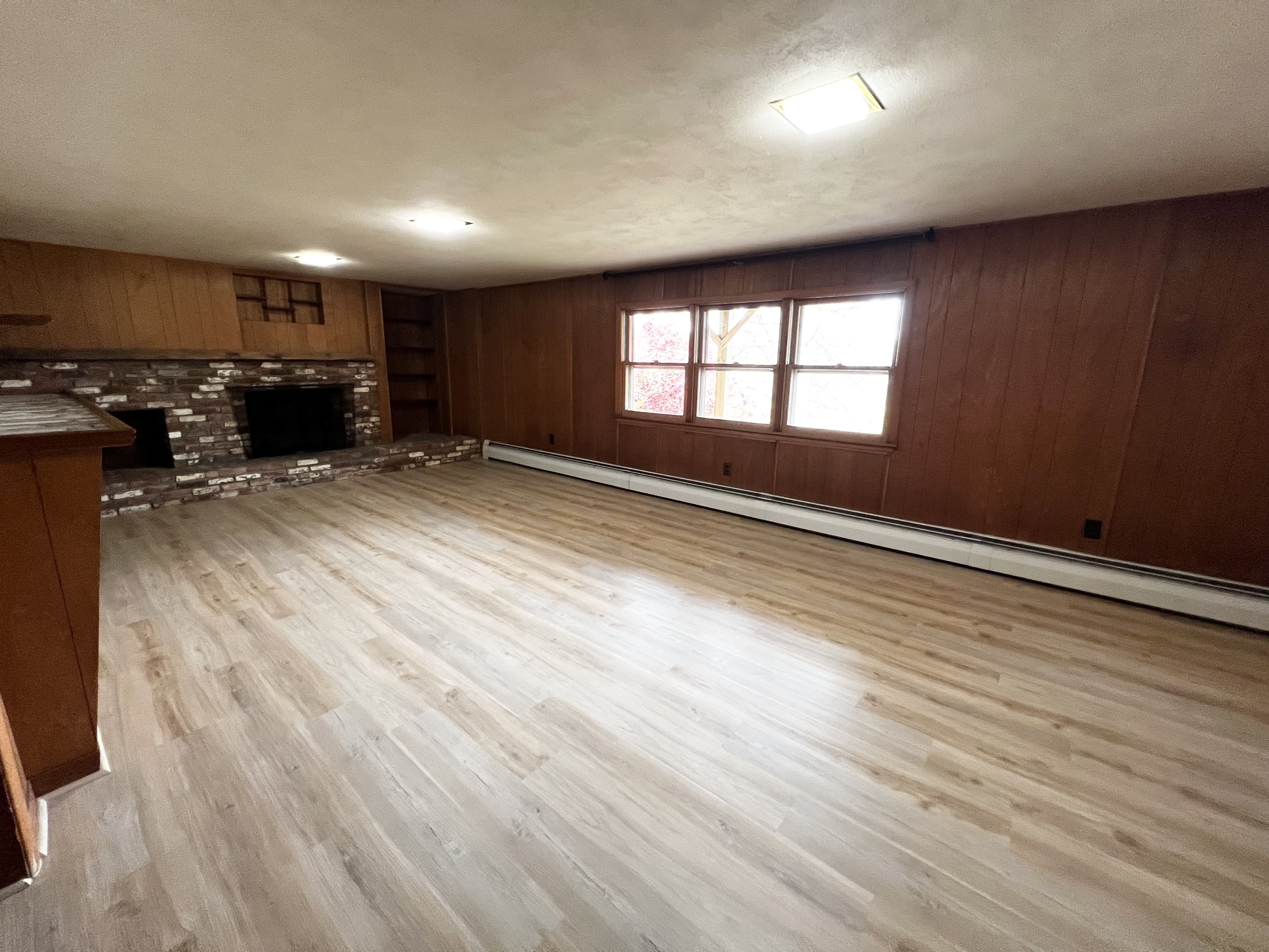 524 Saybrook Road Haddam, CT 06438 - Photo 33 of 38 an empty room with wooden floor and windows