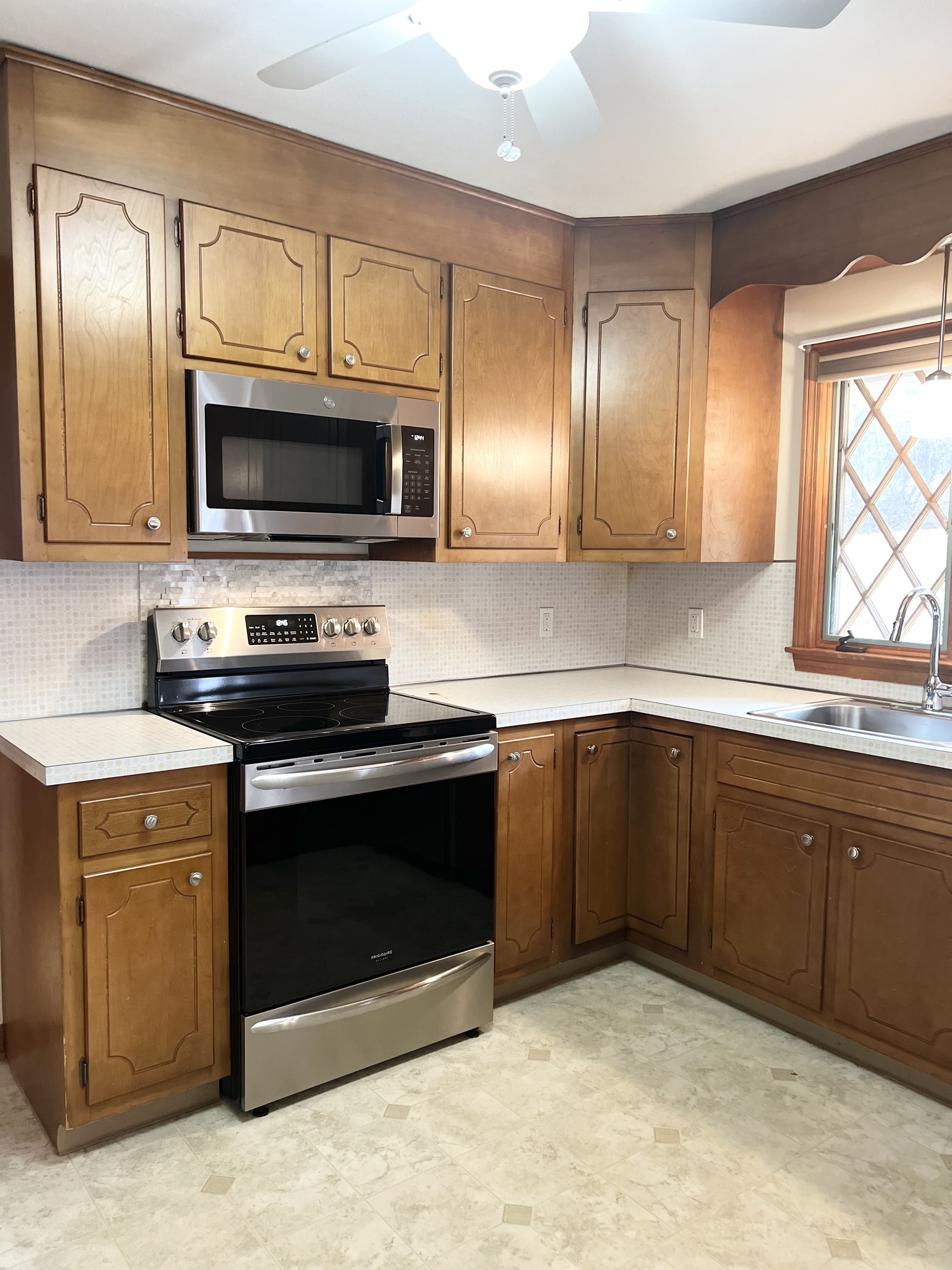 524 Saybrook Road Haddam, CT 06438 - Photo 7 of 38 a kitchen with a sink stove and microwave
