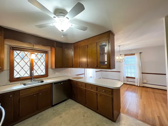 a kitchen with a refrigerator and cabinets