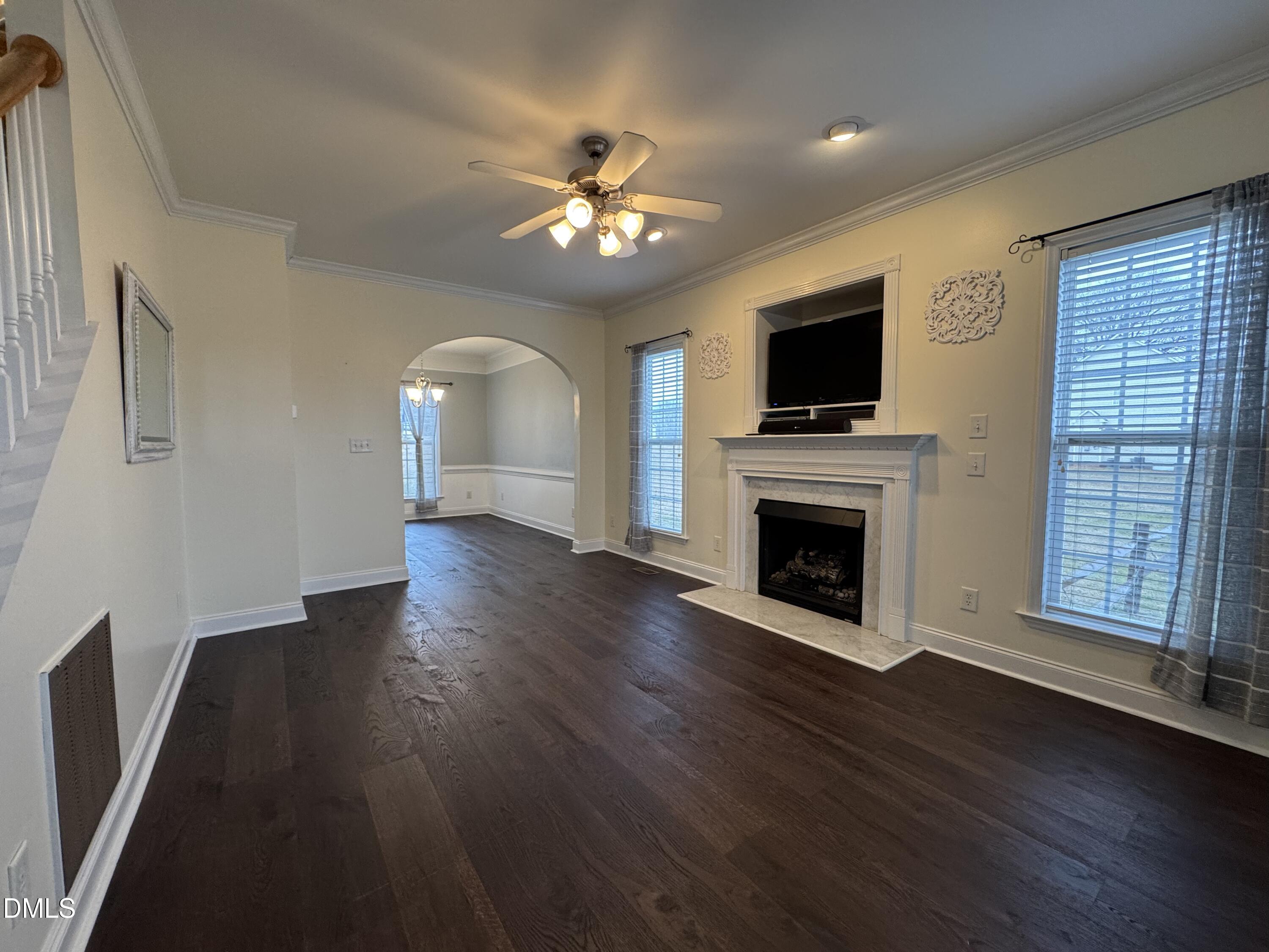 51 Water Front Lane Timberlake, NC 27583 - Photo 18 of 57 a view of an empty room with wooden floor fireplace and a window