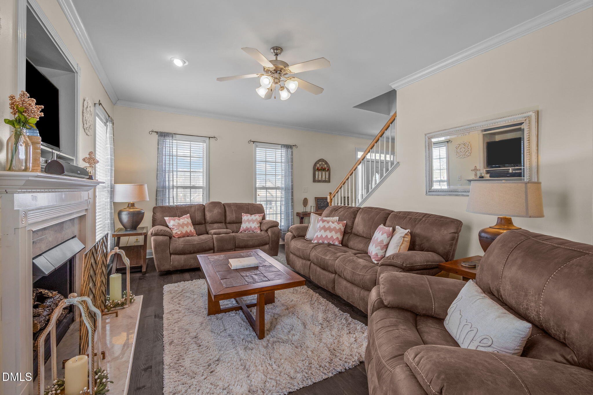 51 Water Front Lane Timberlake, NC 27583 - Photo 19 of 57 a living room with furniture a fireplace and a flat screen tv