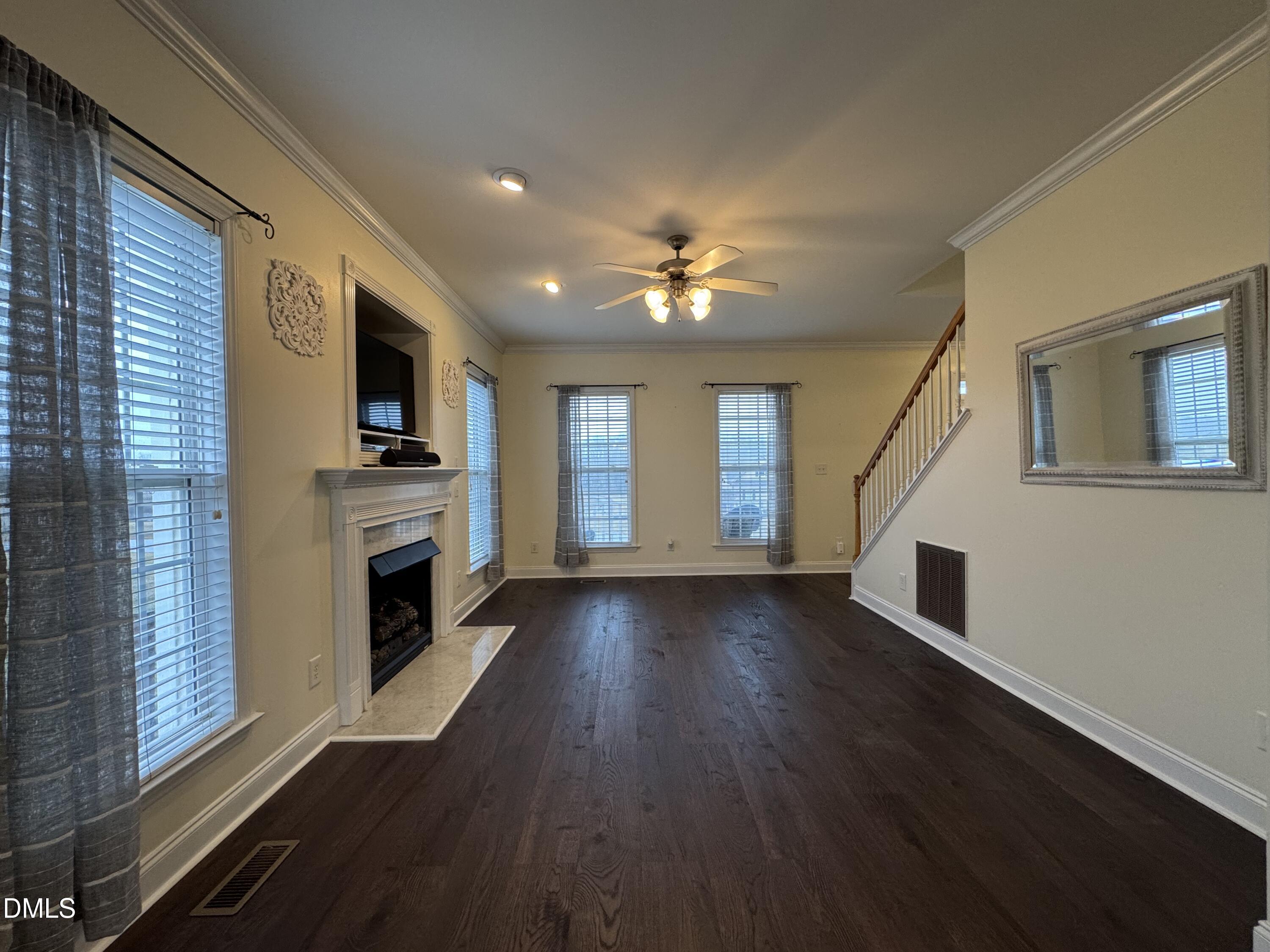 51 Water Front Lane Timberlake, NC 27583 - Photo 20 of 57 a view of a livingroom with a fireplace window and wooden floor