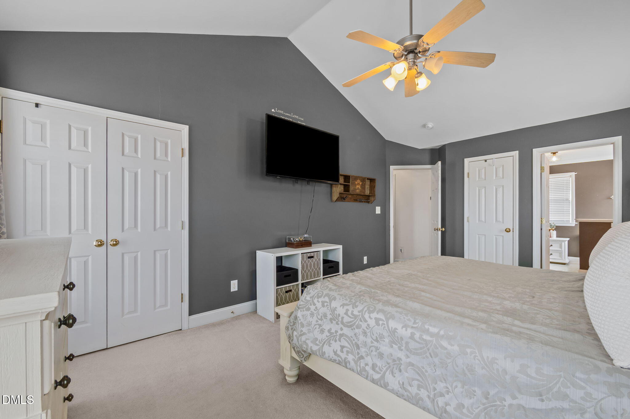 51 Water Front Lane Timberlake, NC 27583 - Photo 23 of 57 a bedroom with a bed and a flat screen tv