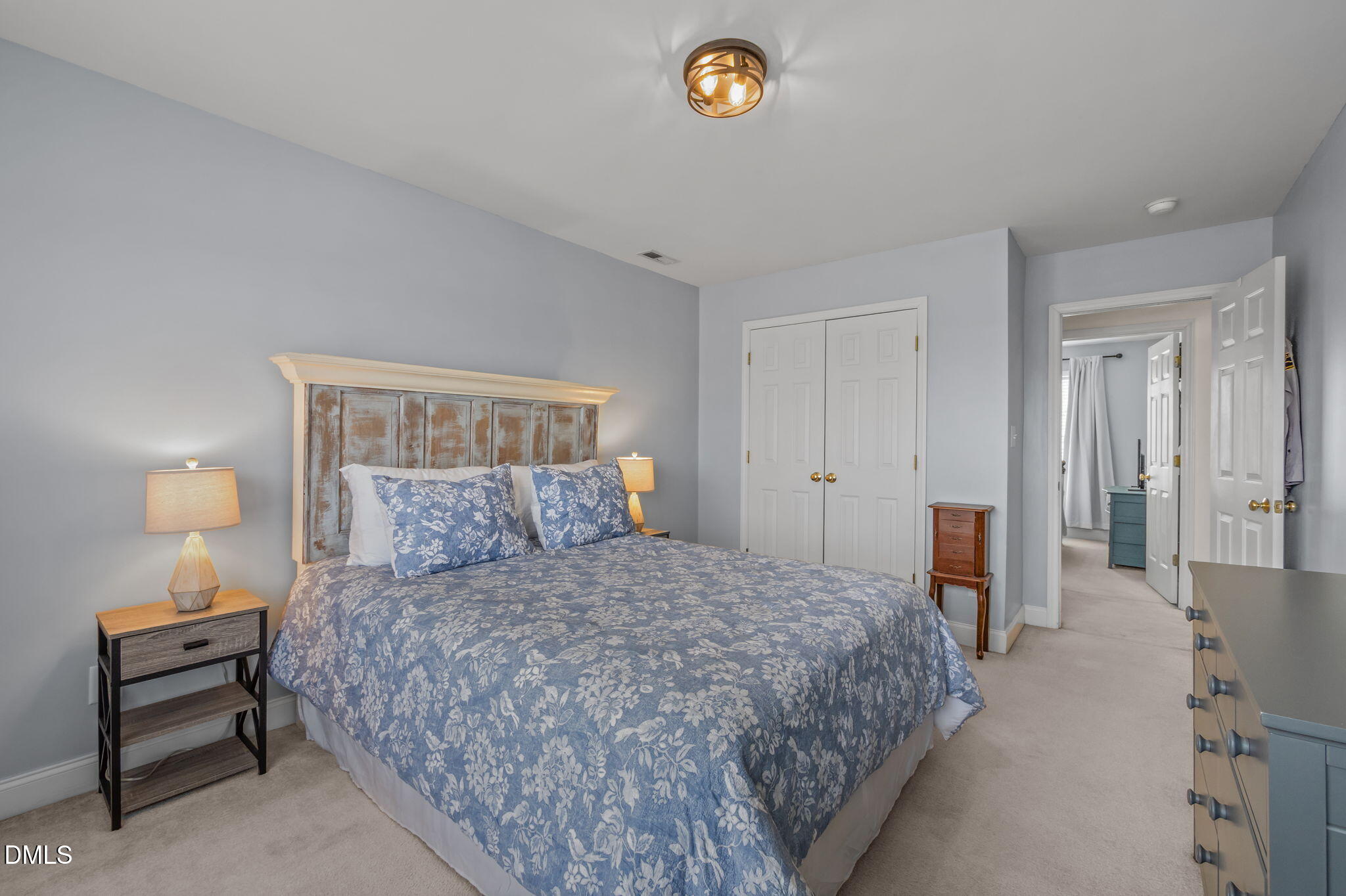 51 Water Front Lane Timberlake, NC 27583 - Photo 26 of 57 a bedroom with a bed and a lamp