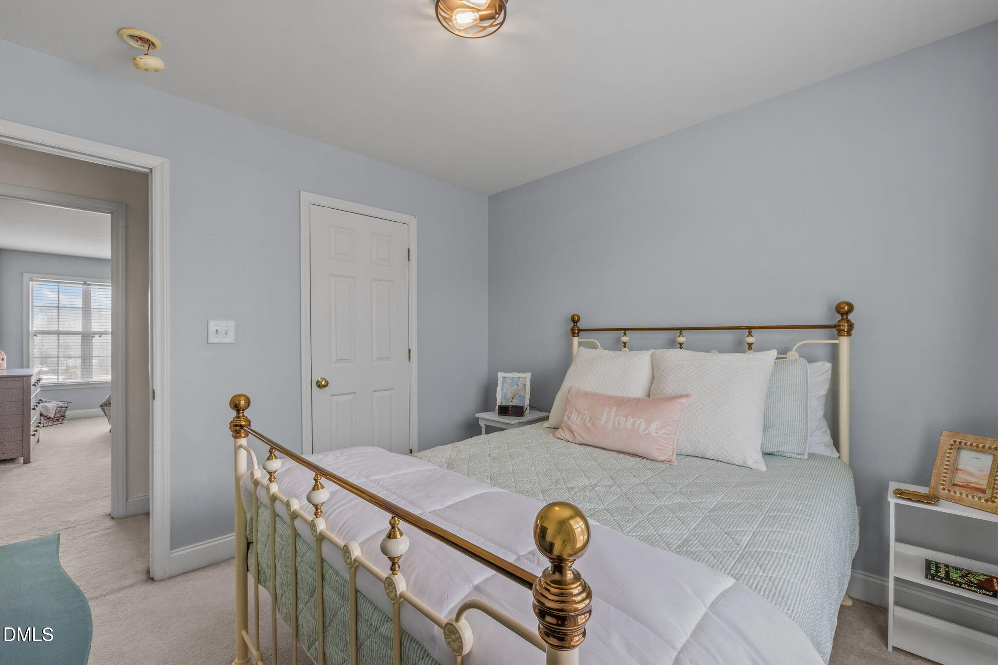 51 Water Front Lane Timberlake, NC 27583 - Photo 30 of 57 a bedroom with a bed and wooden floor