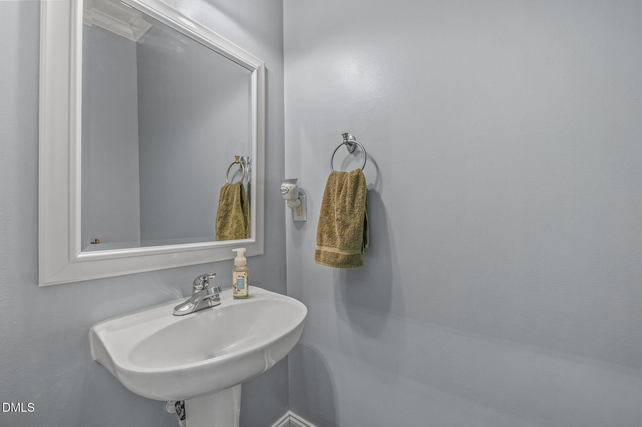 51 Water Front Lane Timberlake, NC 27583 - Photo 31 of 57 a bathroom with a sink and a mirror