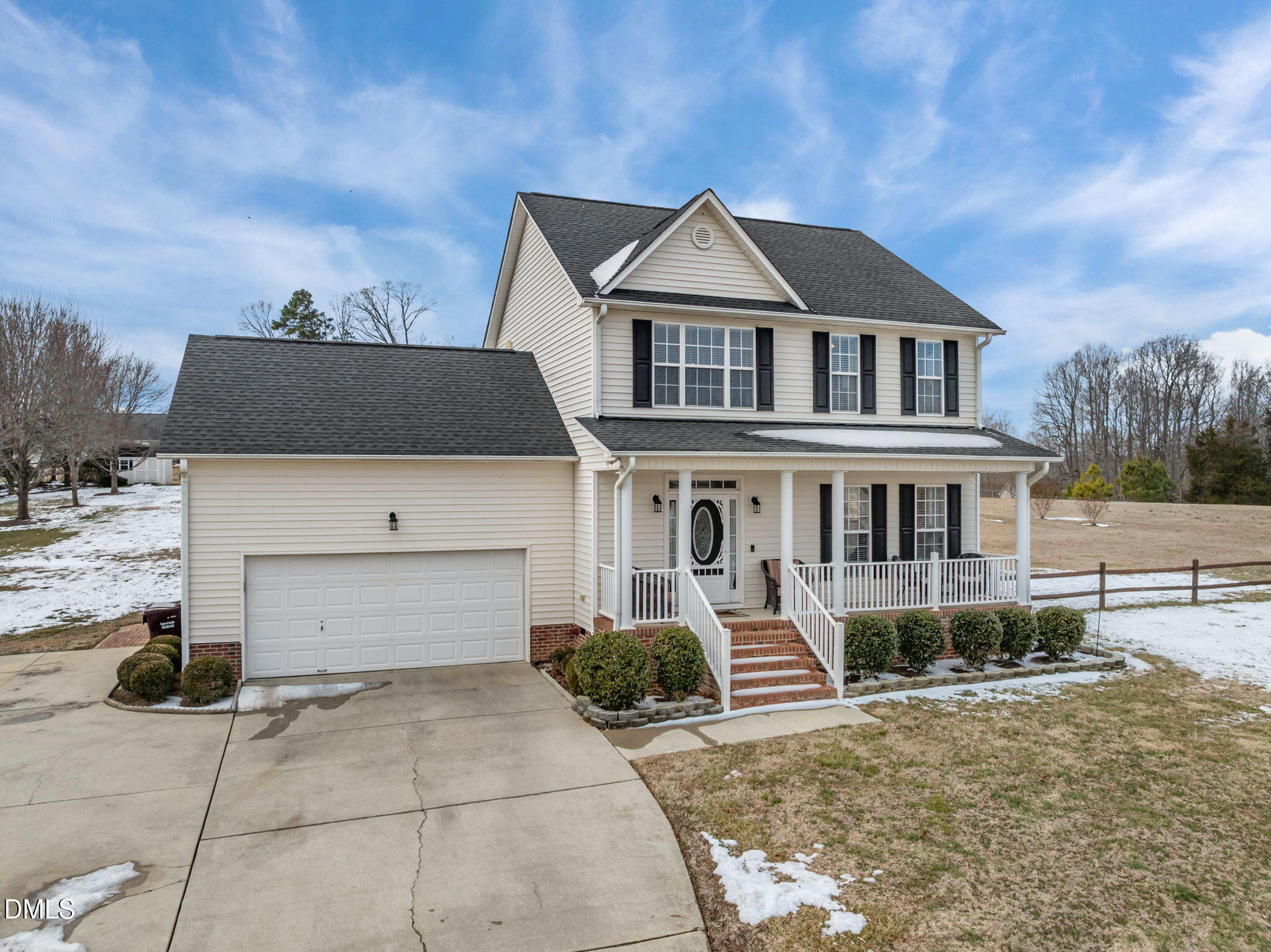 51 Water Front Lane Timberlake, NC 27583 - Photo 37 of 57 a front view of a house with a yard and garage