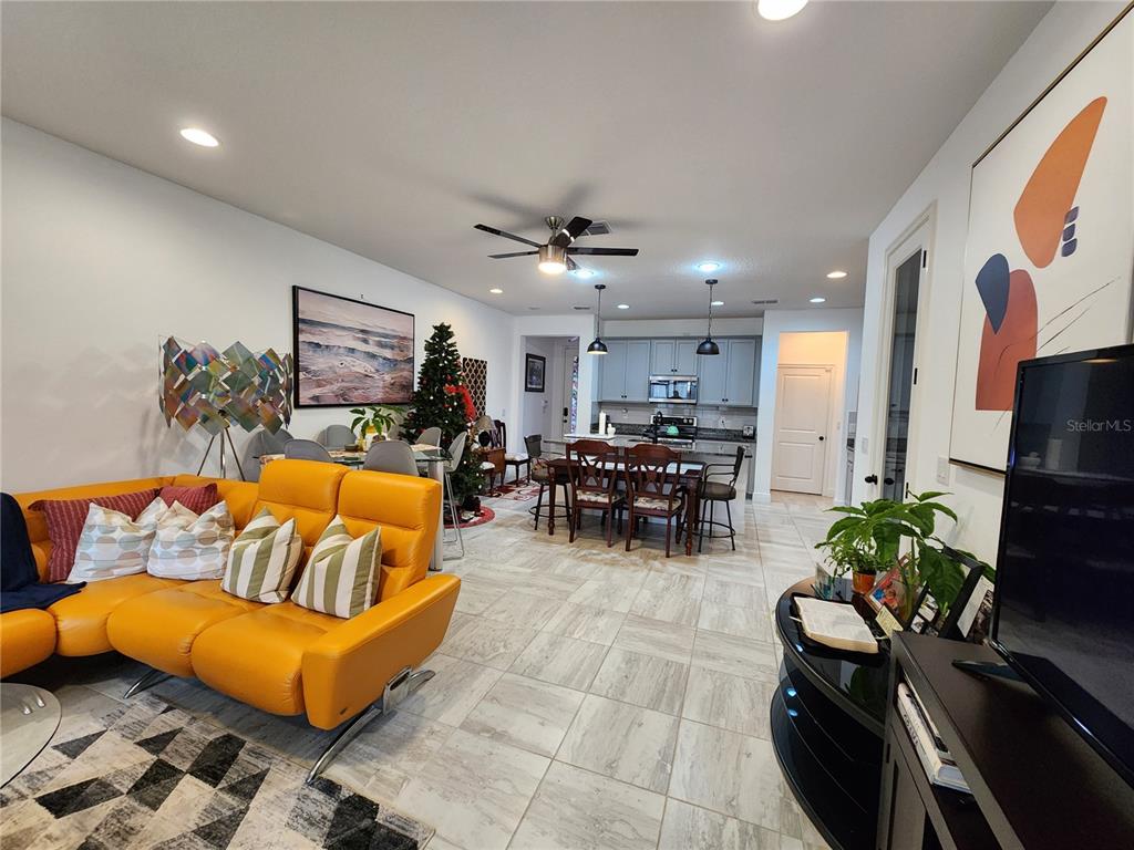 5508 Viola Lee Way Lutz, FL 33558 - Photo 14 of 60 a living room with furniture kitchen view and a potted plant