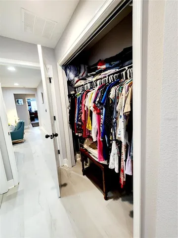 a bathroom with a double vanity sink and mirror with shower