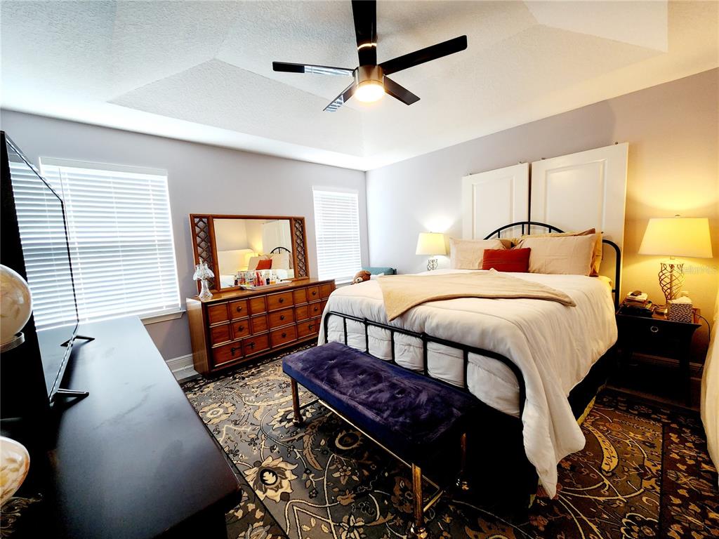 5508 Viola Lee Way Lutz, FL 33558 - Photo 22 of 60 a bedroom with bed mirror and window