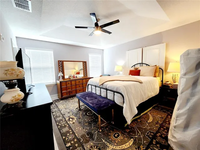 a bathroom with double vanity and a mirror