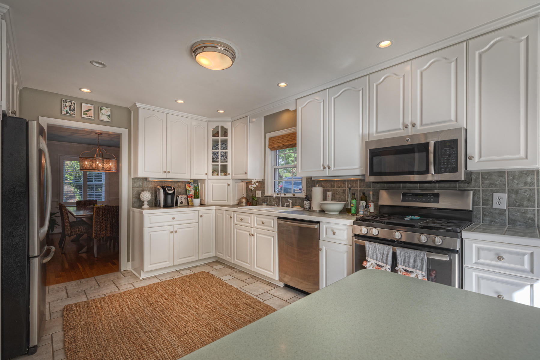 201 Parkcrest Road Southwest Roanoke, VA 24014 - Photo 17 of 39 a kitchen with a stove a sink and a microwave
