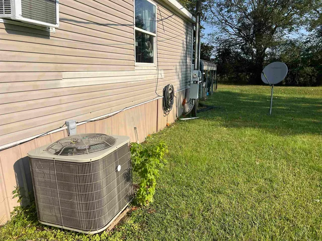a backyard of a house with fountain and entertaining space