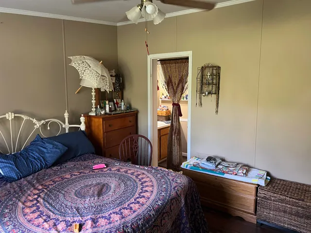 a bed room with a bed and a television