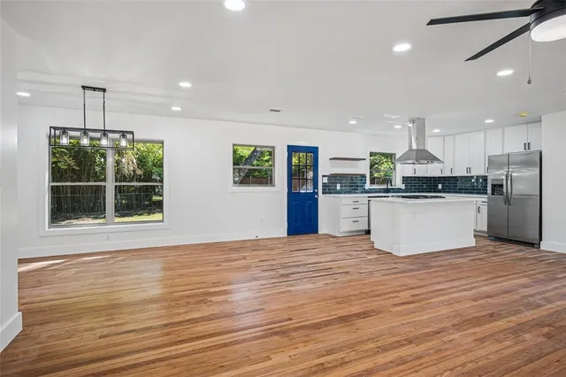 a view of kitchen with wooden floor and window