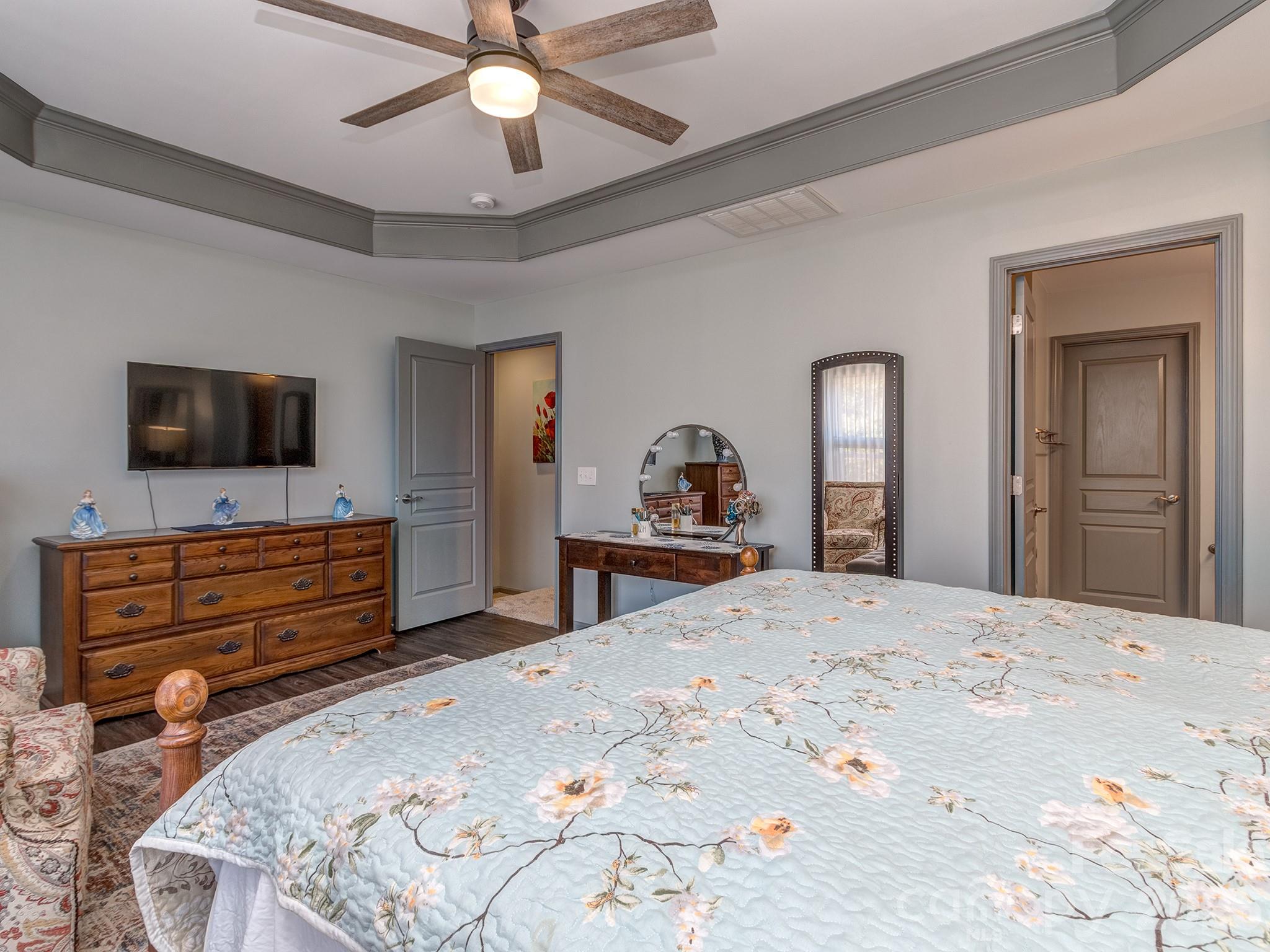 6236 Rockefeller Lane Charlotte, NC 28210 - Photo 16 of 26 a bedroom with a bed and a flat screen tv