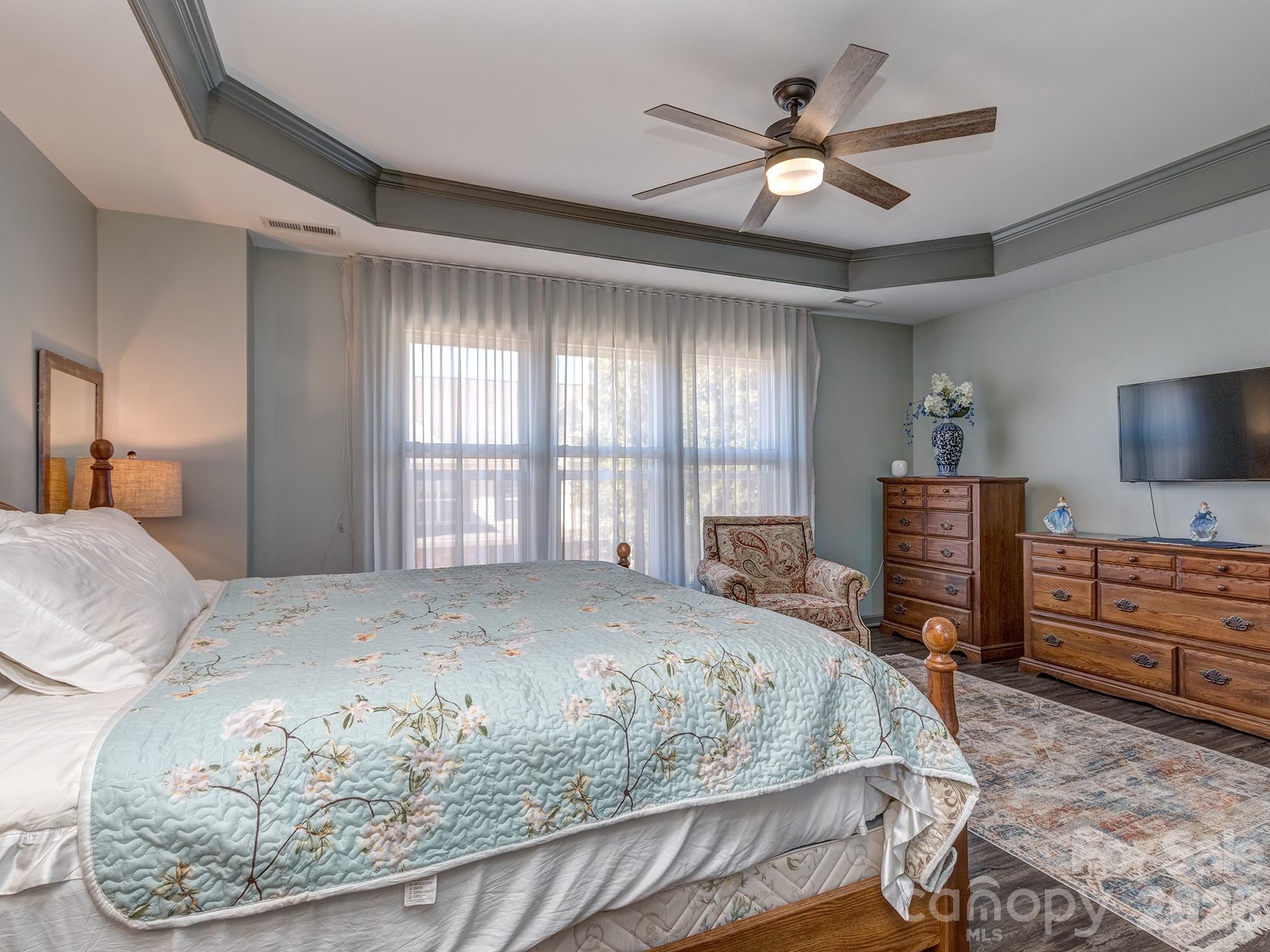 6236 Rockefeller Lane Charlotte, NC 28210 - Photo 17 of 26 a bed room with a bed and a television