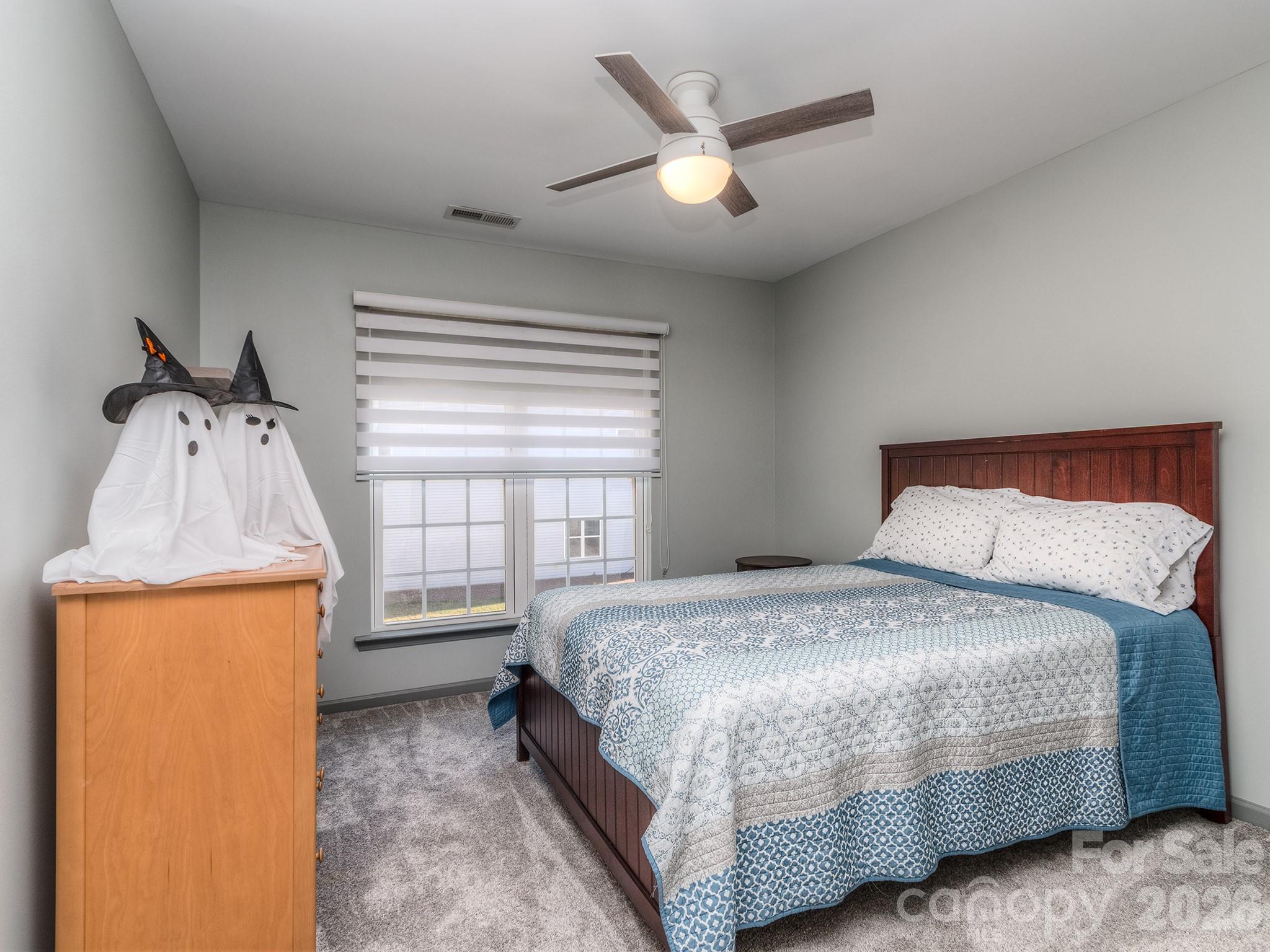 6236 Rockefeller Lane Charlotte, NC 28210 - Photo 22 of 26 a bedroom with a bed and a window