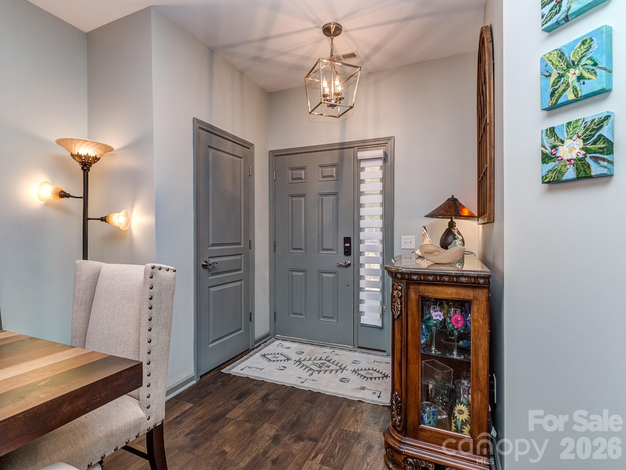 6236 Rockefeller Lane Charlotte, NC 28210 - Photo 5 of 26 a bedroom with furniture and a chandelier