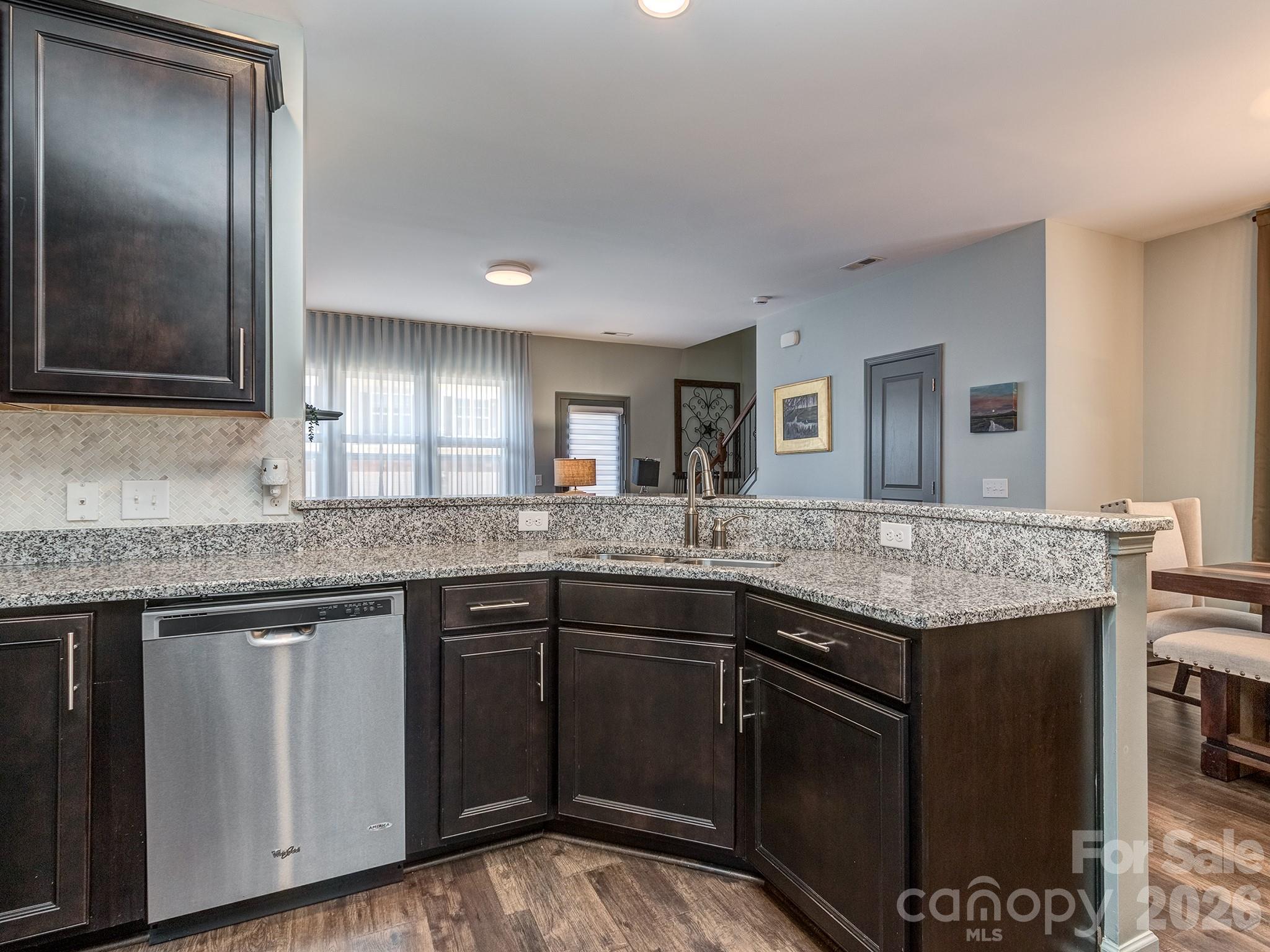 6236 Rockefeller Lane Charlotte, NC 28210 - Photo 7 of 26 a kitchen with granite countertop cabinets a sink and stainless steel appliances