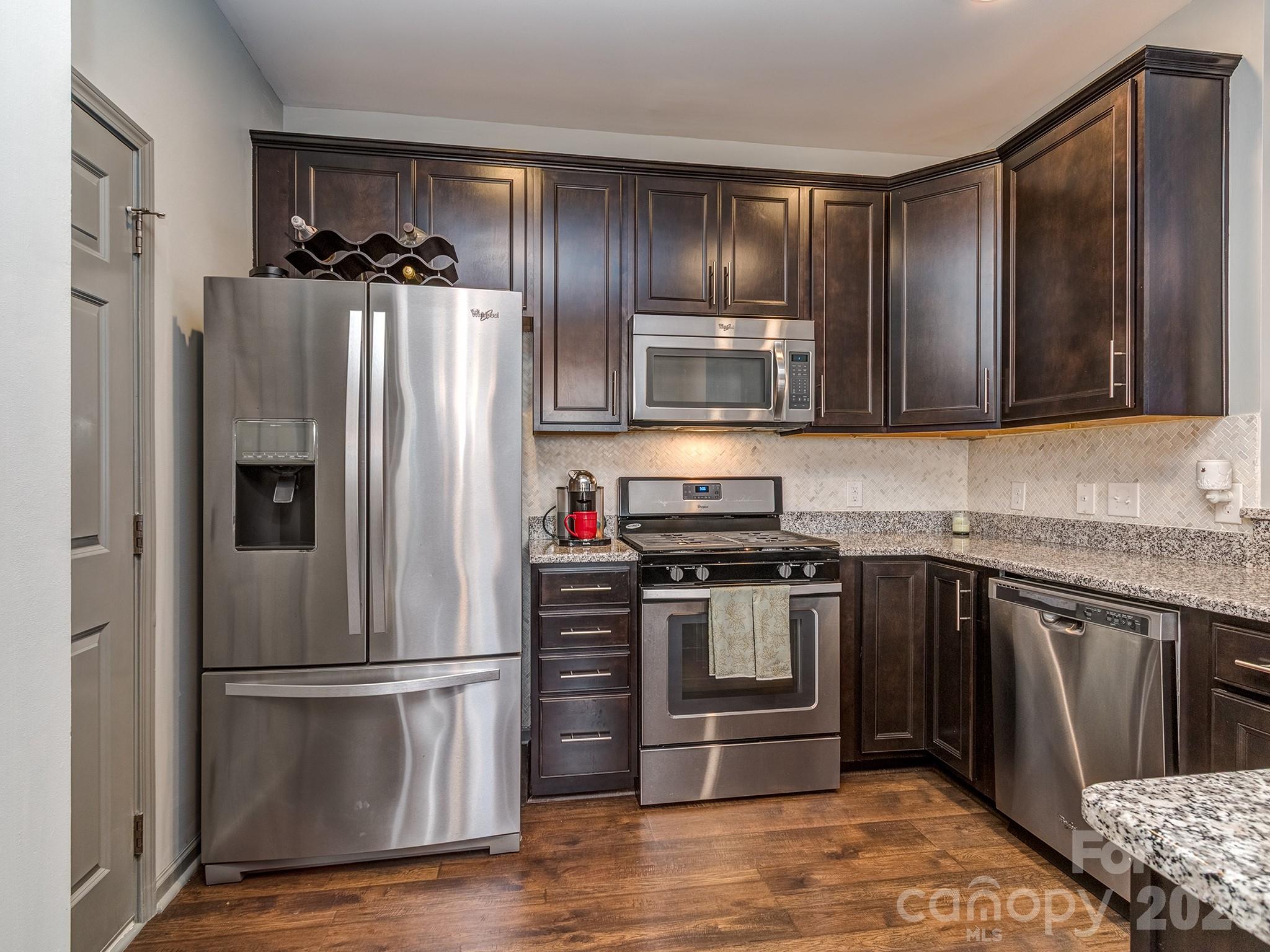 6236 Rockefeller Lane Charlotte, NC 28210 - Photo 8 of 26 a kitchen with stainless steel appliances granite countertop a refrigerator stove and sink