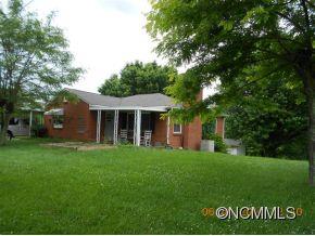 661 Thompson Cove Road Clyde, NC 28721 - Photo 1 of 7 a view of a house with a yard
