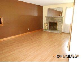 661 Thompson Cove Road Clyde, NC 28721 - Photo 4 of 7 a view of an empty room with a fireplace
