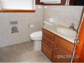 661 Thompson Cove Road Clyde, NC 28721 - Photo 5 of 7 a bathroom with a sink and a toilet