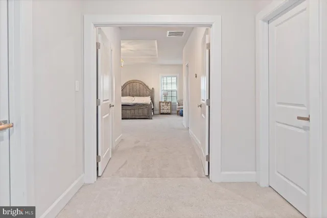 a view of a livingroom from a hallway