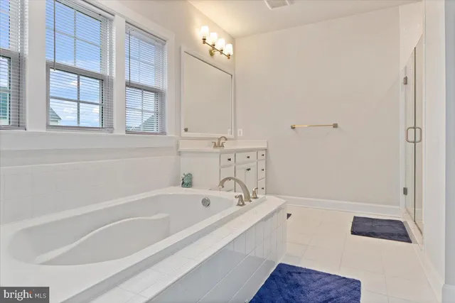 a white bath tub sitting next to a window