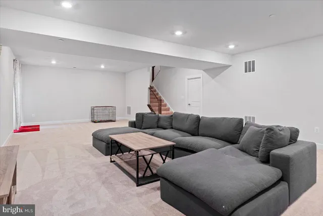 a living room with furniture and a couch