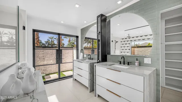 a view of bathroom with dual sinks