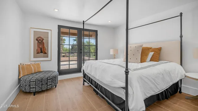 a bedroom with bed and a couch